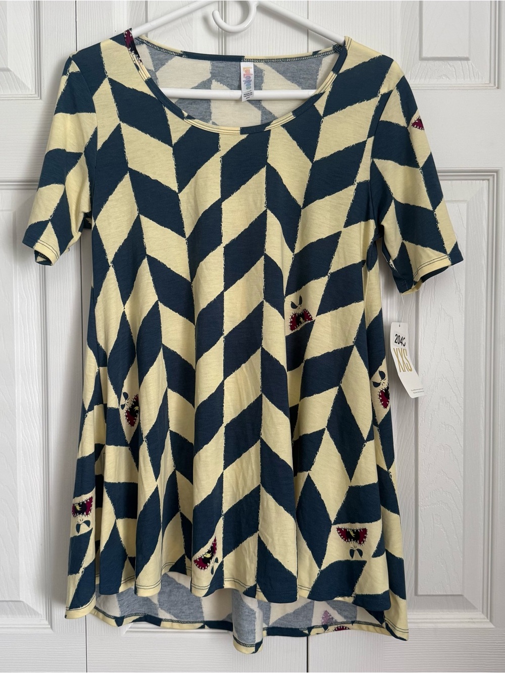 LuLaRoe Navy and Cream Chevron Swing Top with Small Red Accents